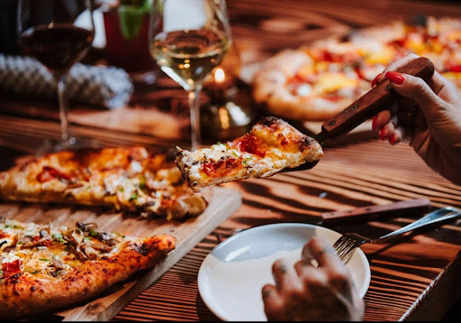 Pizza and wine served during a Toronto FIFA World Cup watch party dining experience