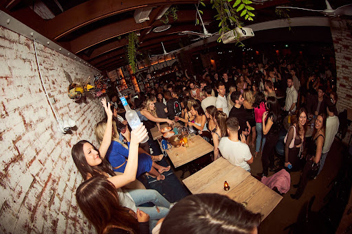 Late-night crowd and bottle service atmosphere in Toronto during FIFA World Cup celebrations