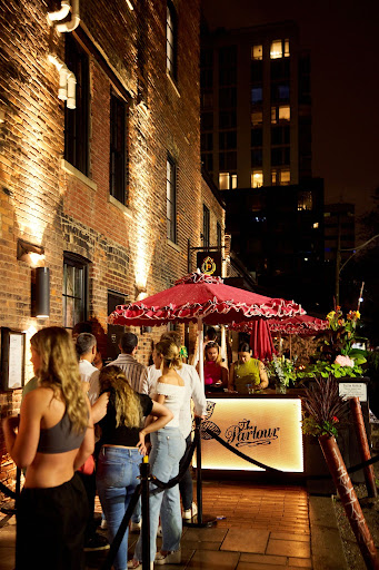 Guests lining up outside a Toronto restaurant and patio during FIFA World Cup nightlife hours
