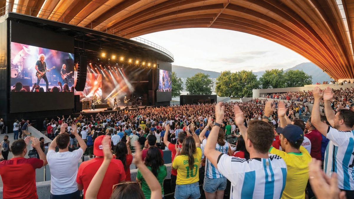 Crowd of soccer fans in national team jerseys celebrating during a large-scale FIFA World Cup viewing event at an outdoor stadium venue