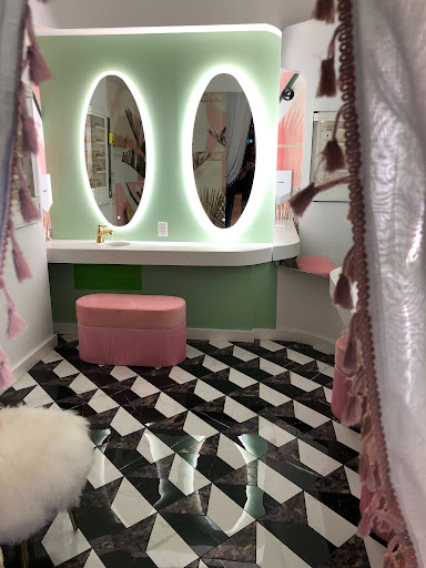 Iconic Powder Room inside The Parlour Toronto featuring pastel mirrors, checkerboard flooring, and hidden King West restaurant design